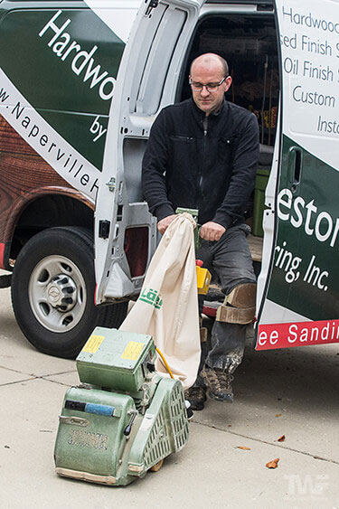 Unloading wood floor machines ready for sanding